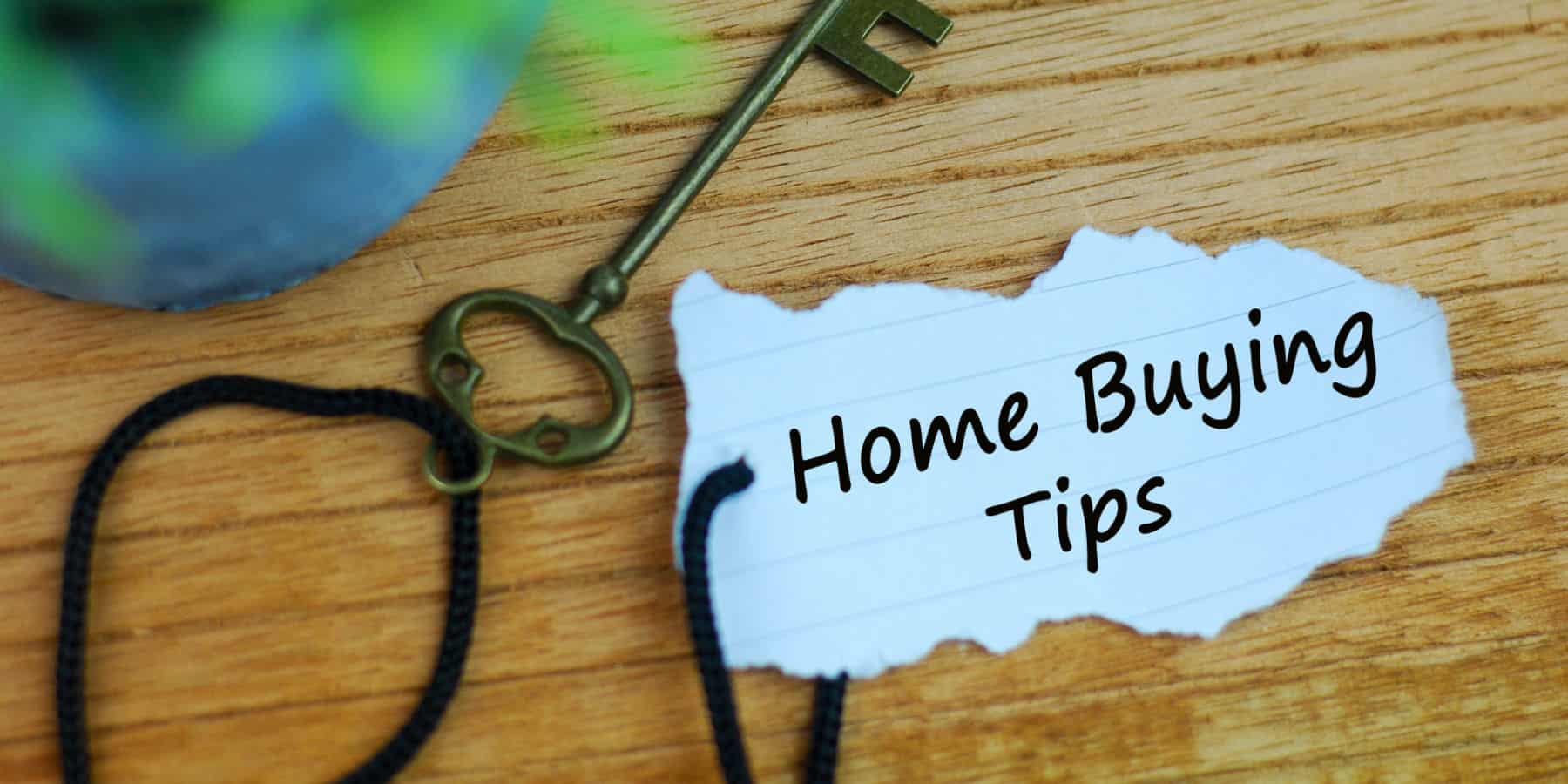 Home buying tips on paper attached to old key